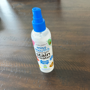 Spray stain remover on wooden surface